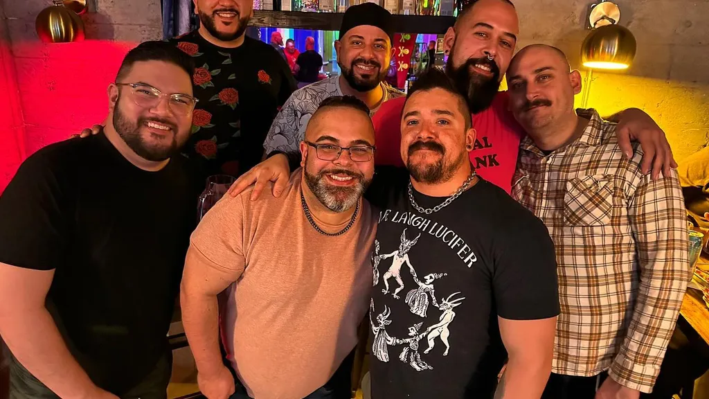 A group of men that would identify as bears, standing together at Lumberyard Bar in Seattle Washington